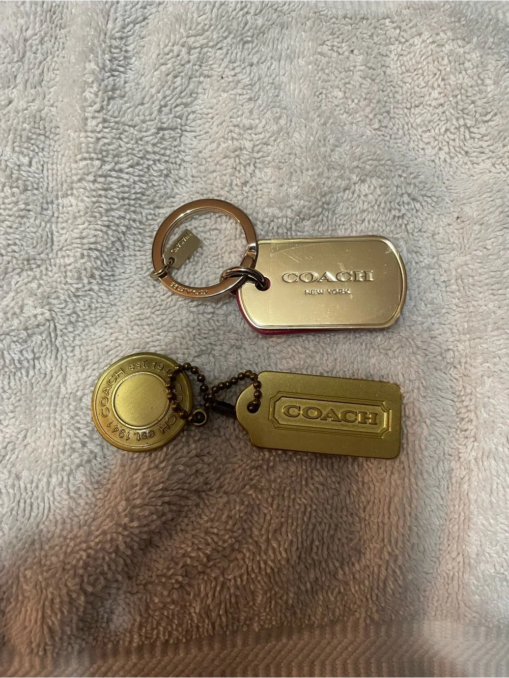 Coach keychain and dog tag